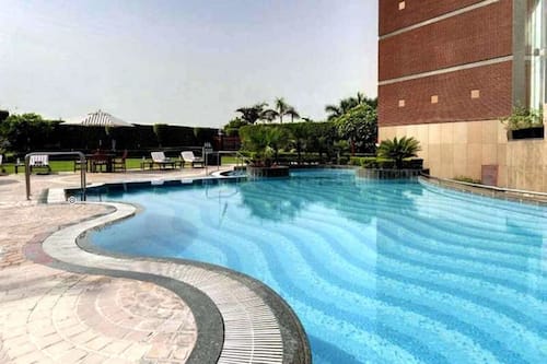 Seasonal outdoor pool, pool umbrellas, pool loungers