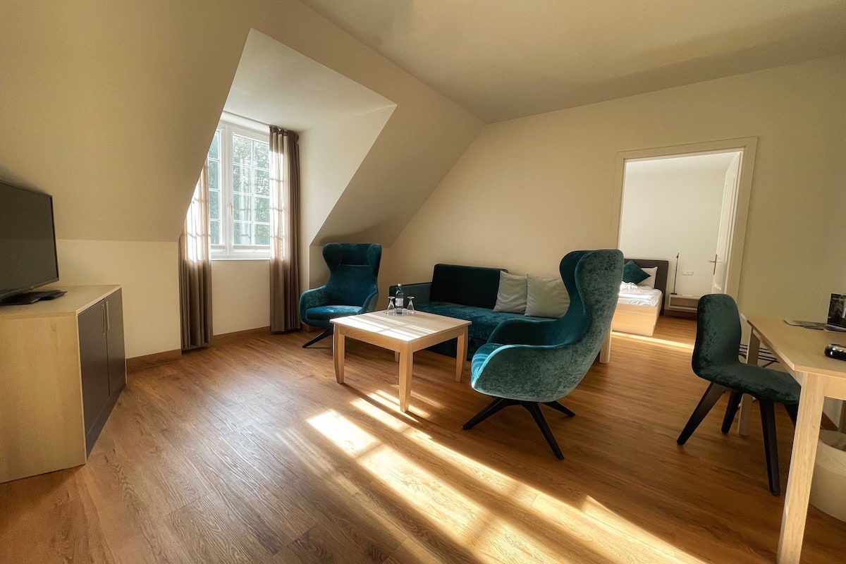 family apartment | living area | flat-screen tv, heated floors