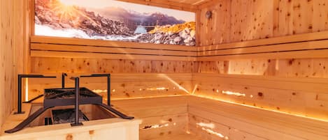 Un sauna, tratamientos corporales, masajes con piedras calientes