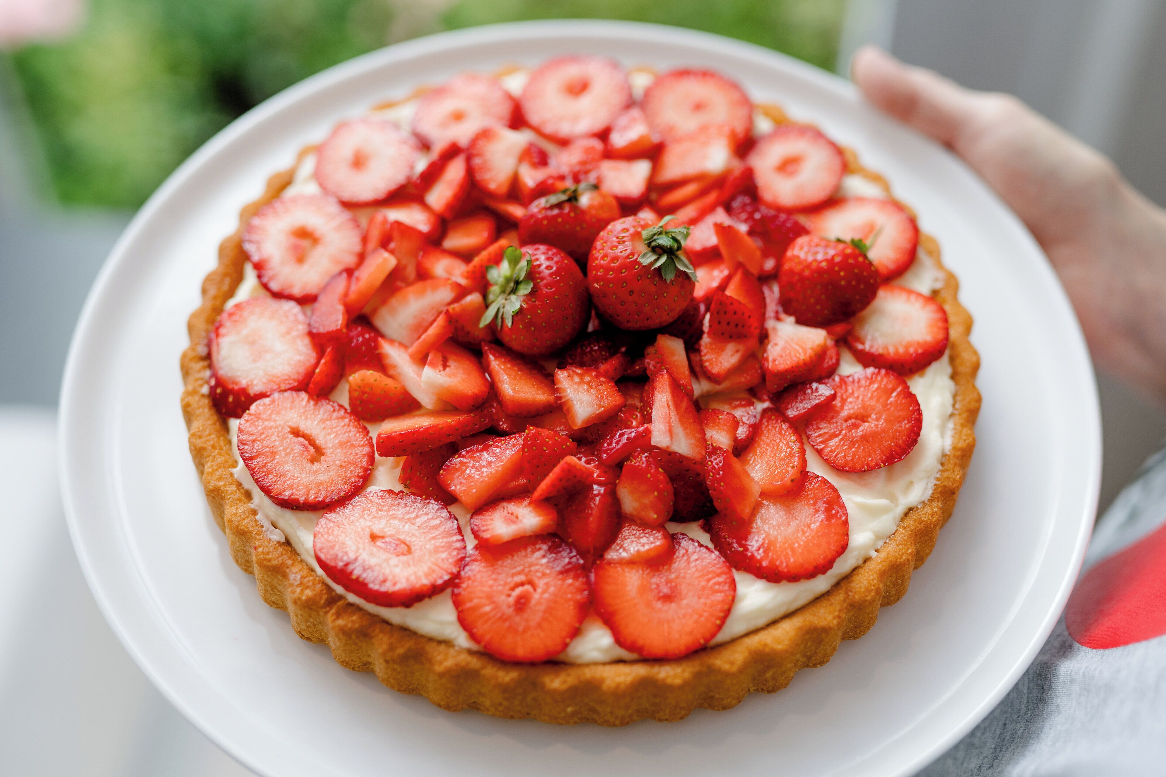 A pie with strawberries on top.