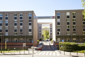A multi-story building with a sign reading "Résidence de Brienne."