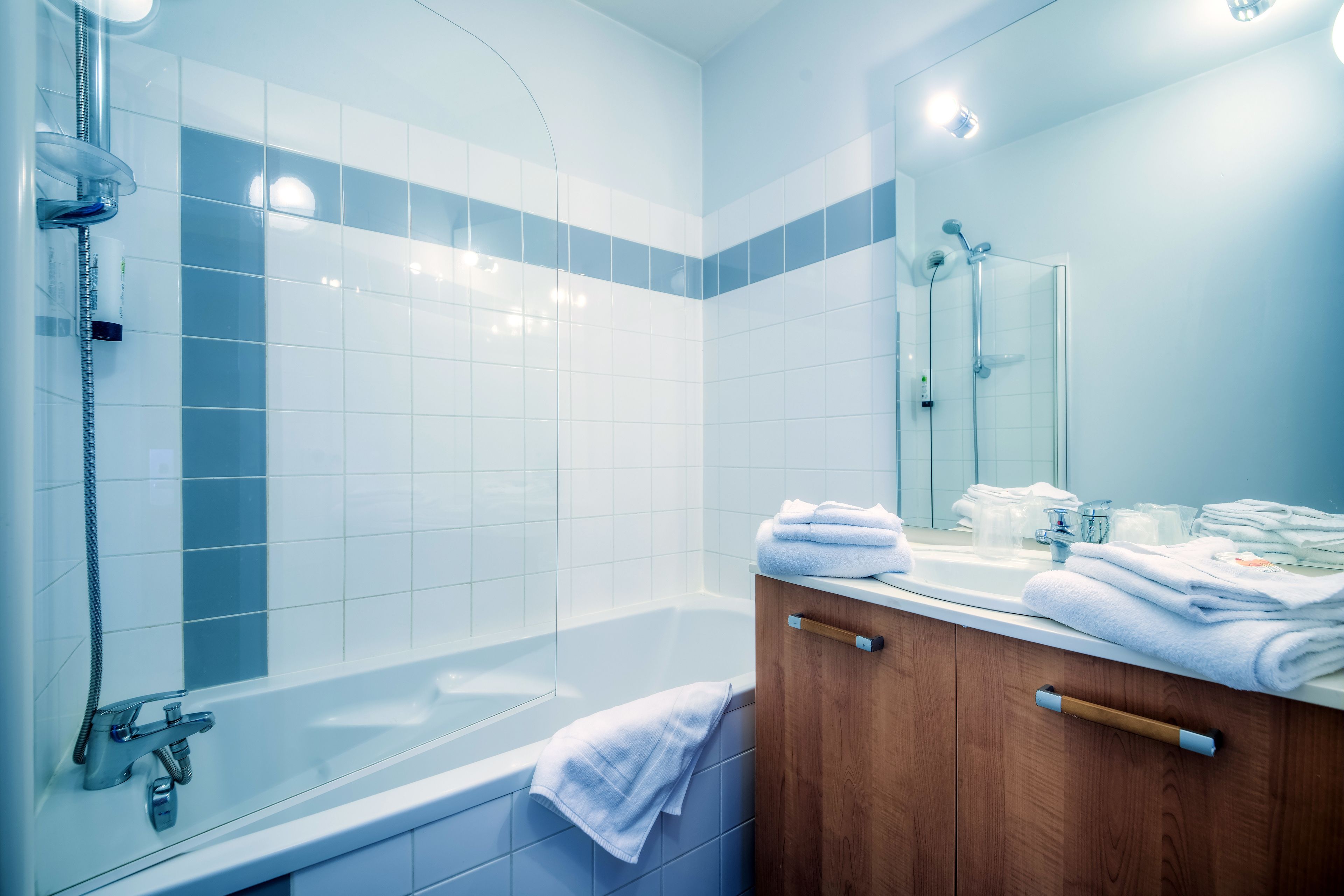 Bathtub, eco-friendly toiletries, hair dryer, towels