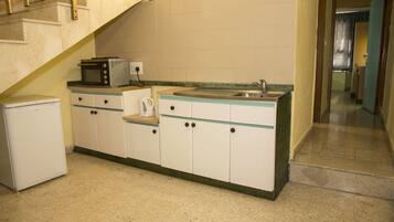 Apartamento, 1 quarto | Cozinha americana privada | Geladeira, cooktop, chaleira elétrica