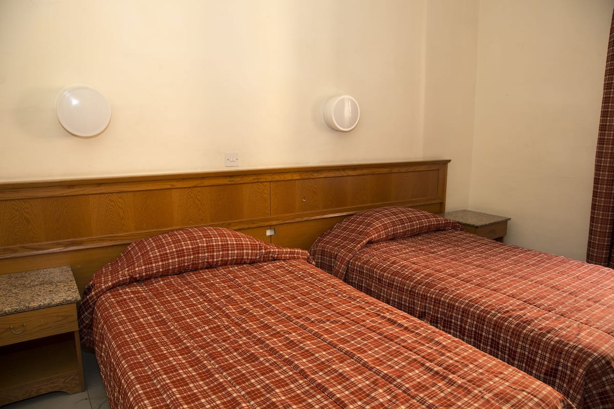Blackout drapes, iron/ironing board (on request), WiFi (free)