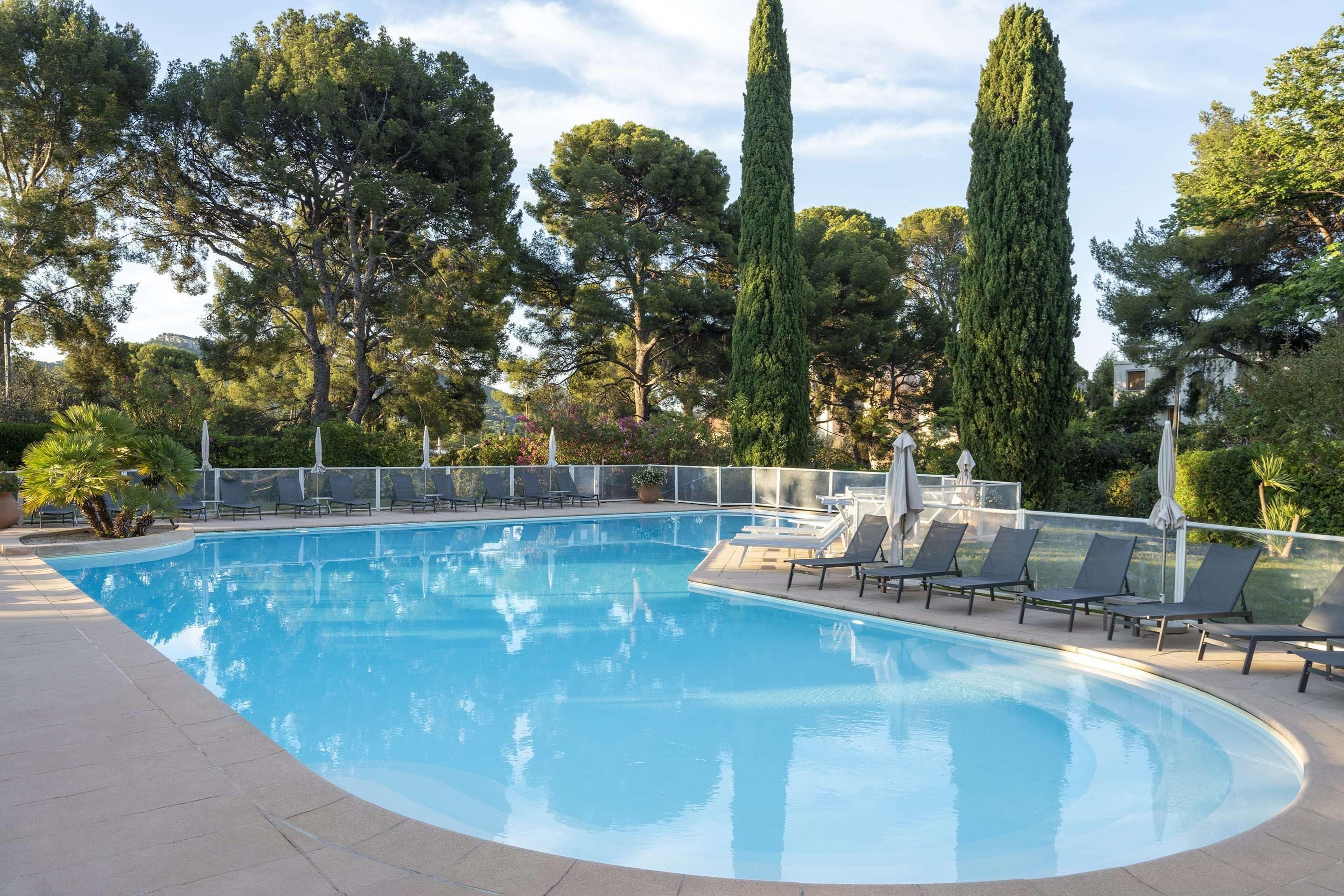 Seasonal outdoor pool, open 9:00 AM to 9:00 PM, pool umbrellas