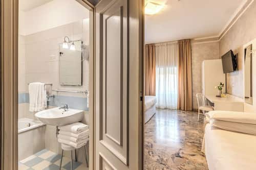 Quadruple Room | Minibar, in-room safe, desk, free WiFi