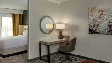 Premium bedding, desk, laptop workspace, blackout drapes