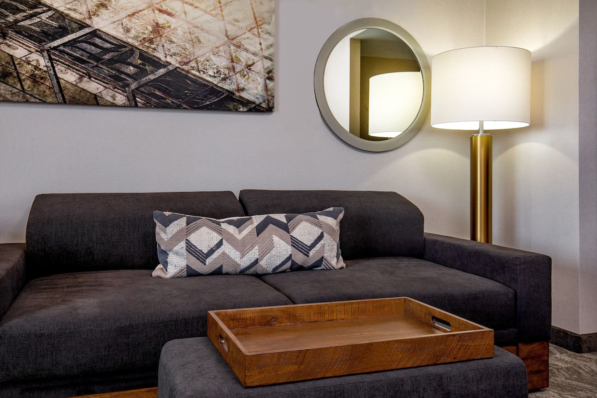 Premium bedding, desk, laptop workspace, blackout drapes