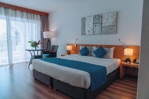 Habitación Deluxe | Ropa de cama hipoalergénica, minibar, caja fuerte y cunas (de pago)