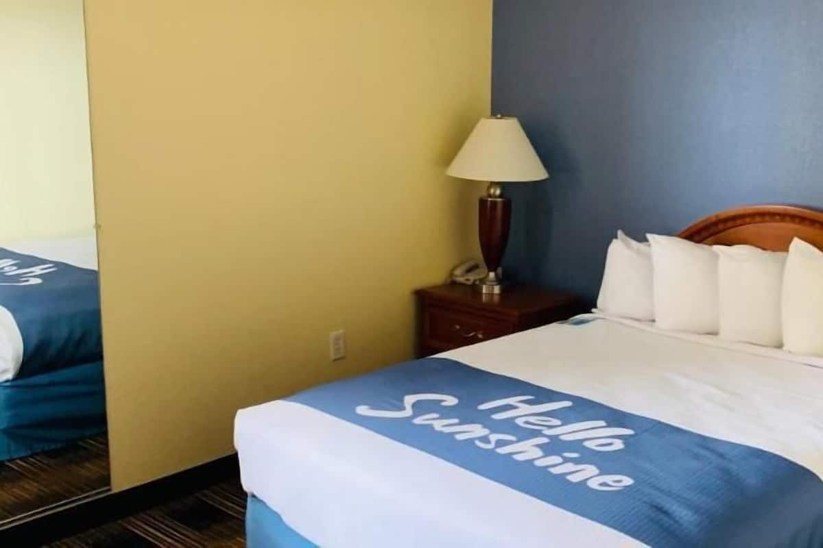 Hypo-allergenic bedding, desk, laptop workspace, blackout curtains