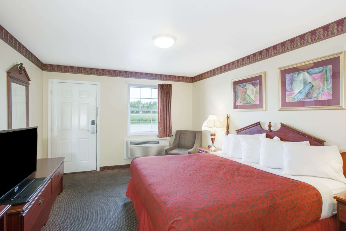Hypo-allergenic bedding, desk, laptop workspace, blackout curtains