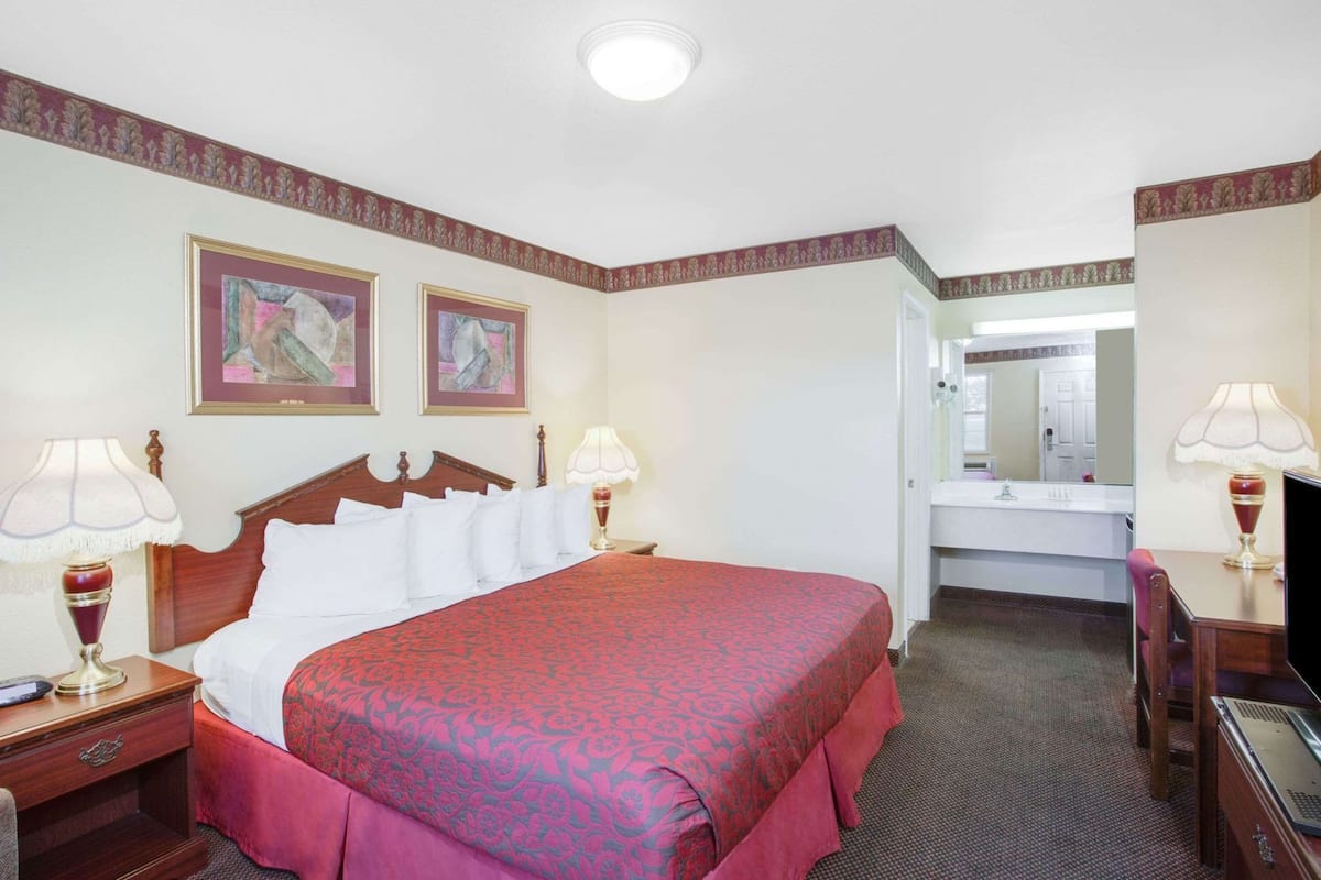 Hypo-allergenic bedding, desk, laptop workspace, blackout curtains