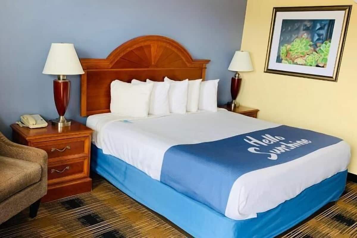 Hypo-allergenic bedding, desk, laptop workspace, blackout curtains