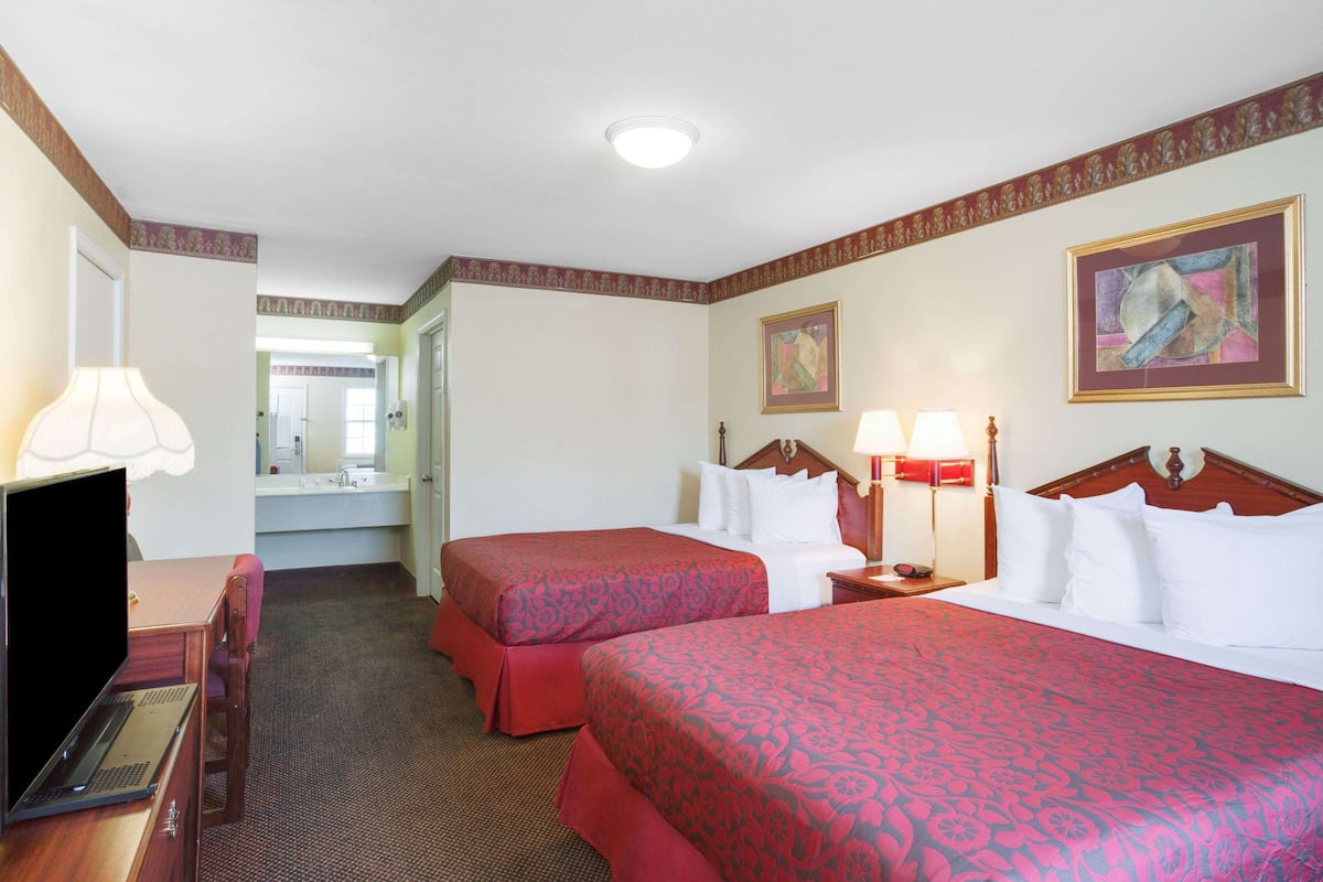 Hypo-allergenic bedding, desk, laptop workspace, blackout curtains