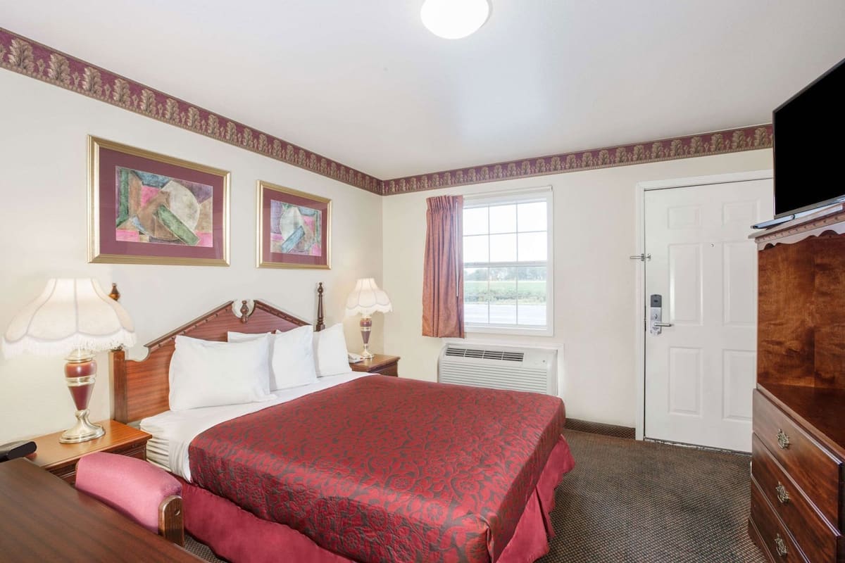 Hypo-allergenic bedding, desk, laptop workspace, blackout curtains