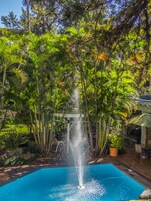 Outdoor pool, open 8:00 AM to 8:00 PM, pool umbrellas