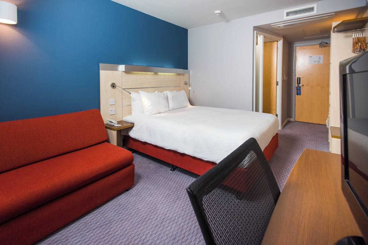 Desk, blackout curtains, free cots/infant beds, free WiFi