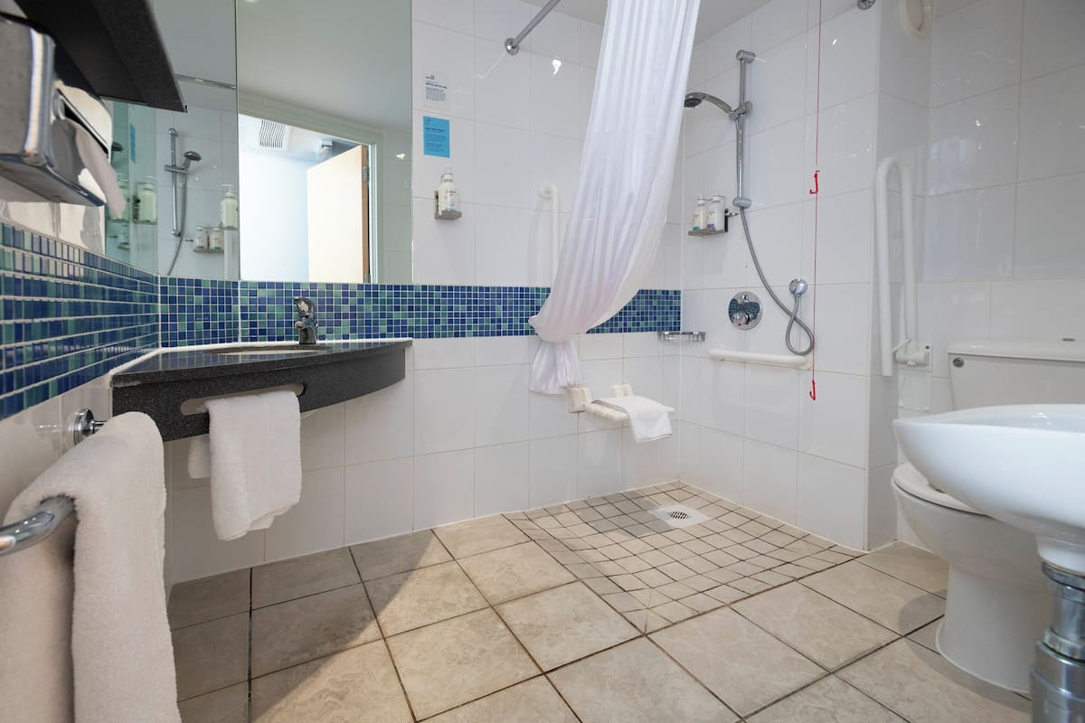 Desk, blackout curtains, free cots/infant beds, free WiFi