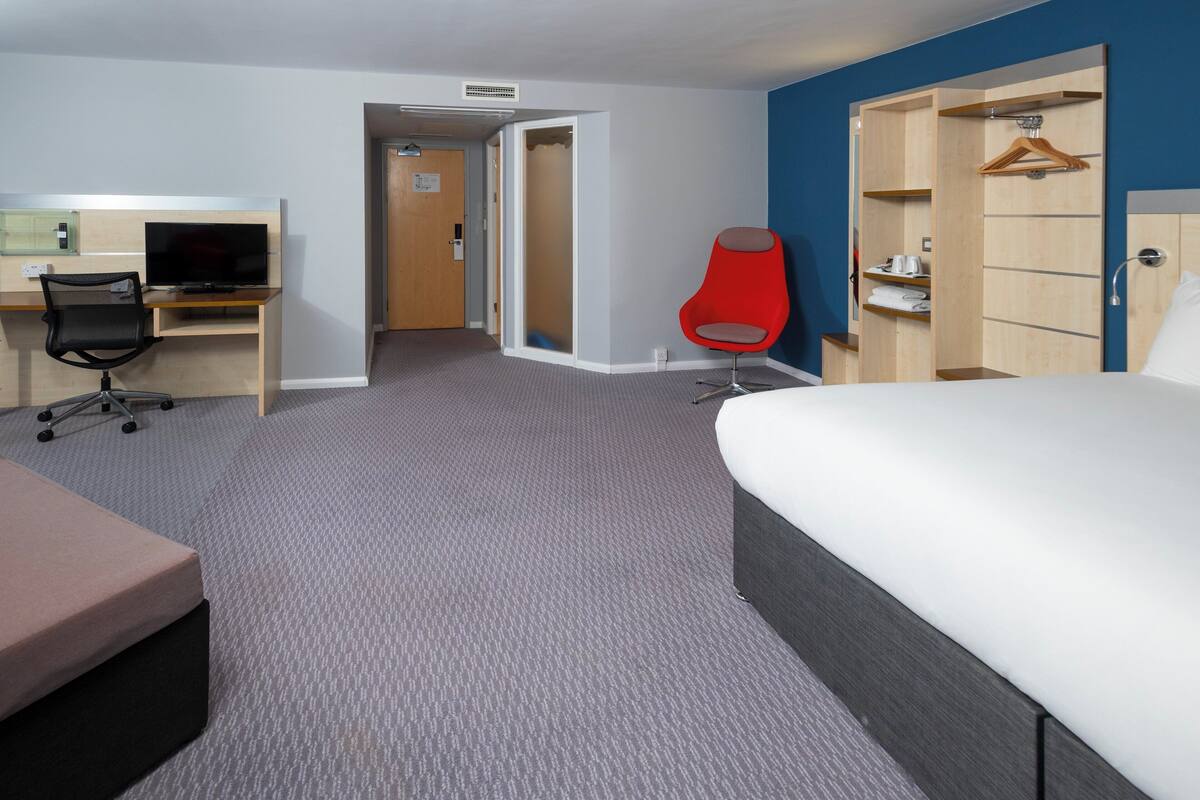 Desk, blackout curtains, free cots/infant beds, free WiFi