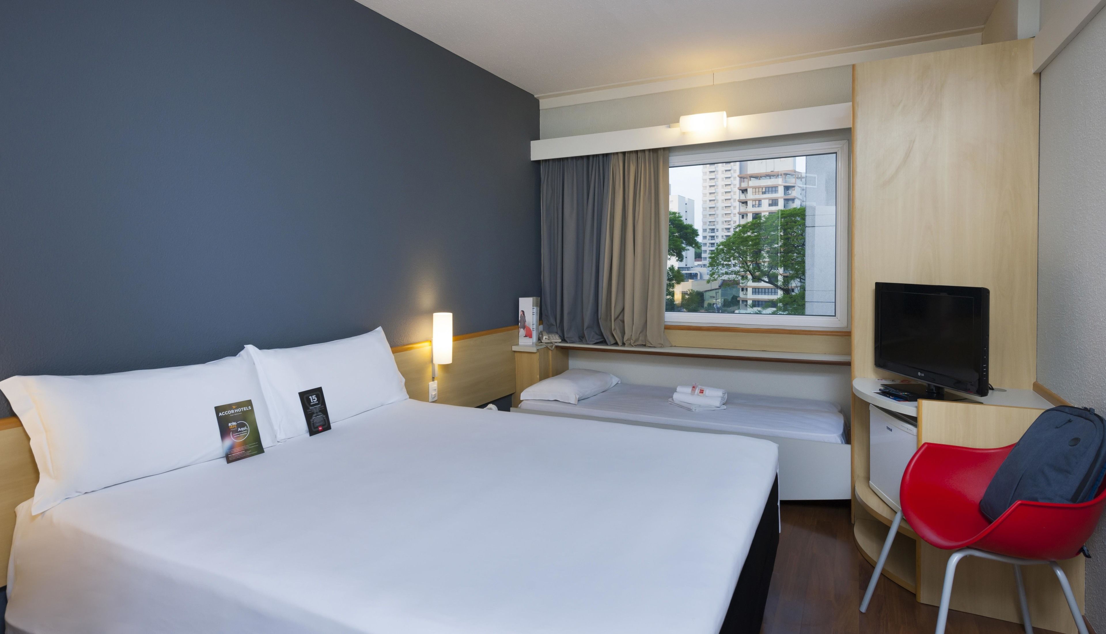 standard room, multiple beds | minibar, in-room safe, desk, blackout curtains