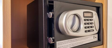 A safe with a keypad and instructions on how to use it.