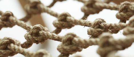 A close-up of a rope netting structure.