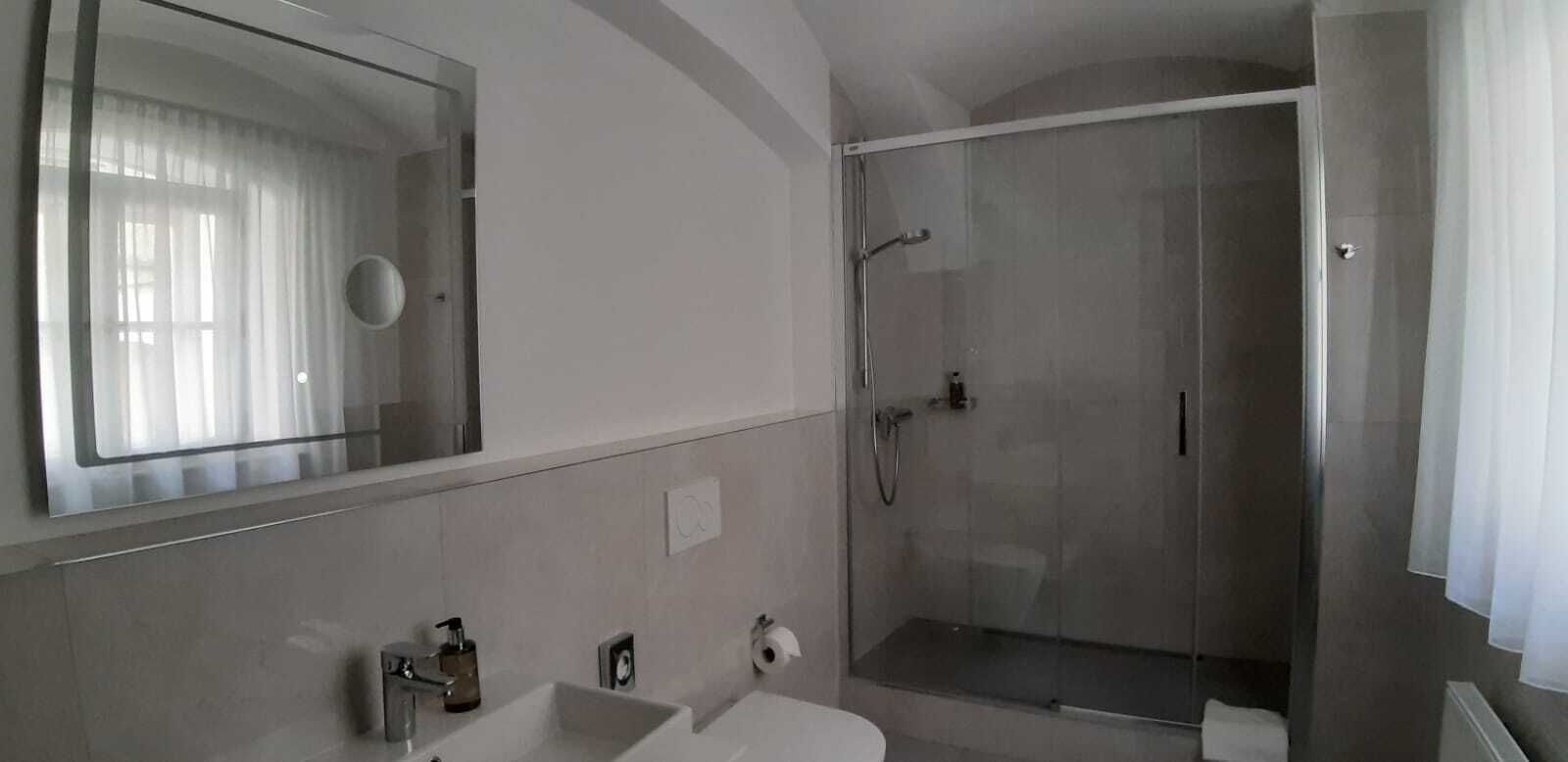 Shower, free toiletries, hair dryer, slippers