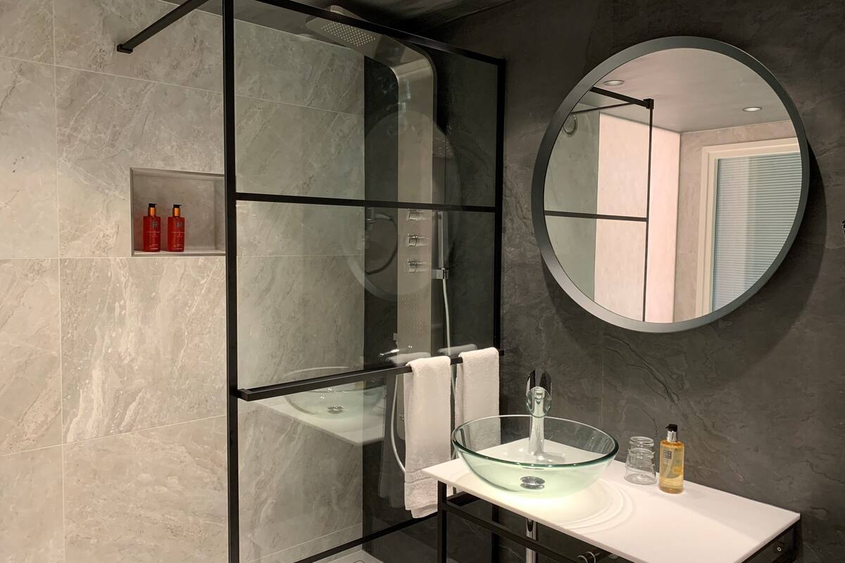 romantic suite (swan lake) | bathroom | separate bathtub and shower, free toiletries, hair dryer, towels