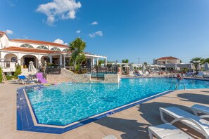 Seasonal outdoor pool, pool umbrellas, pool loungers