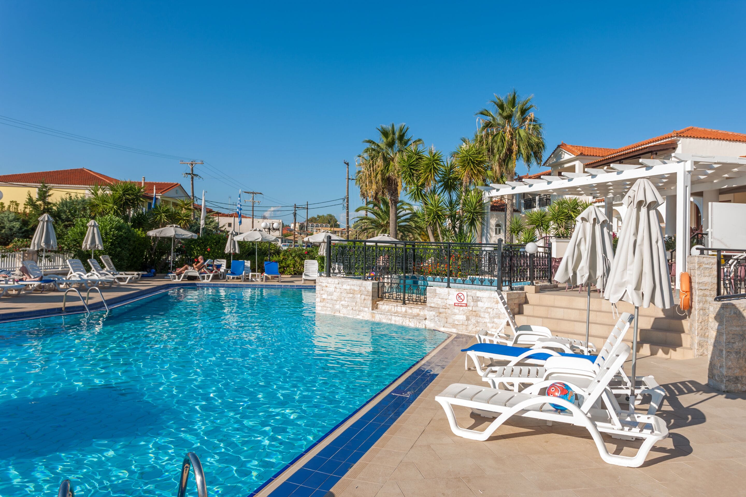 seasonal outdoor pool, pool umbrellas, pool loungers