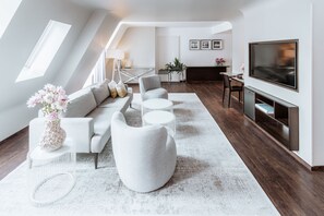 Design Penthouse, Courtyard View | Living area | 40-inch TV with satellite channels