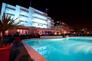 Indoor pool, outdoor pool, pool umbrellas, pool loungers