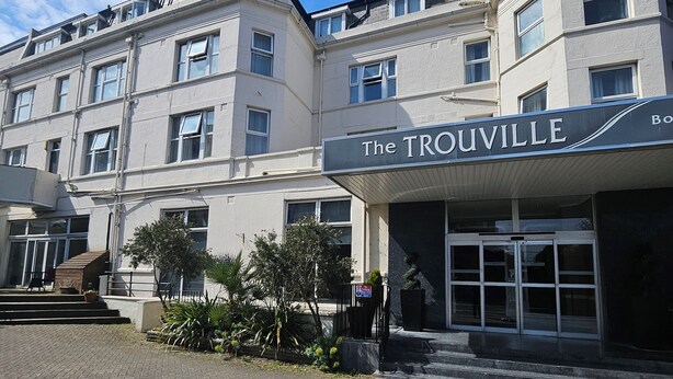 A building with a sign reading "The TROUVILLE".