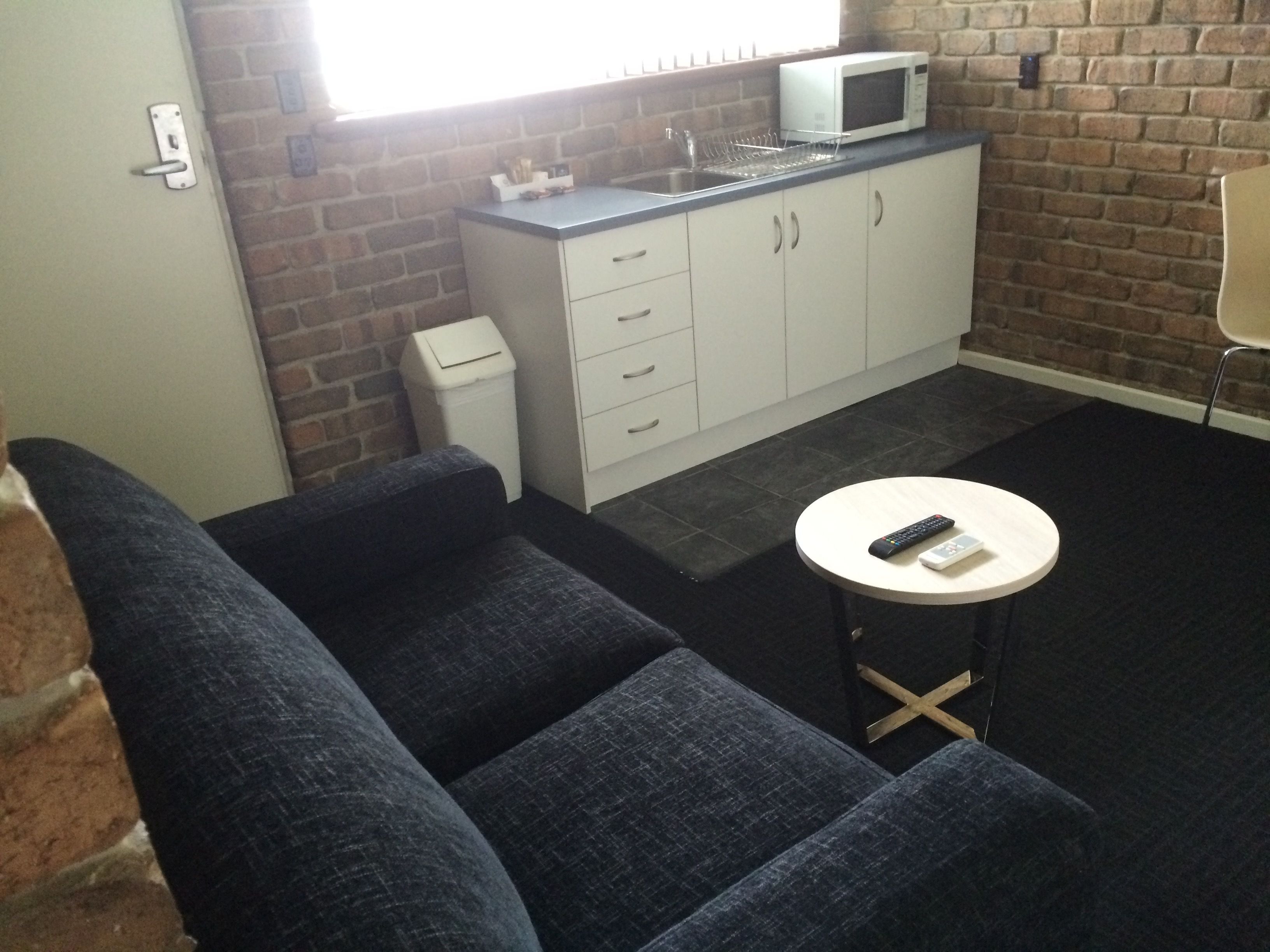 standard room, kitchenette | living area | 32-inch tv with cable channels