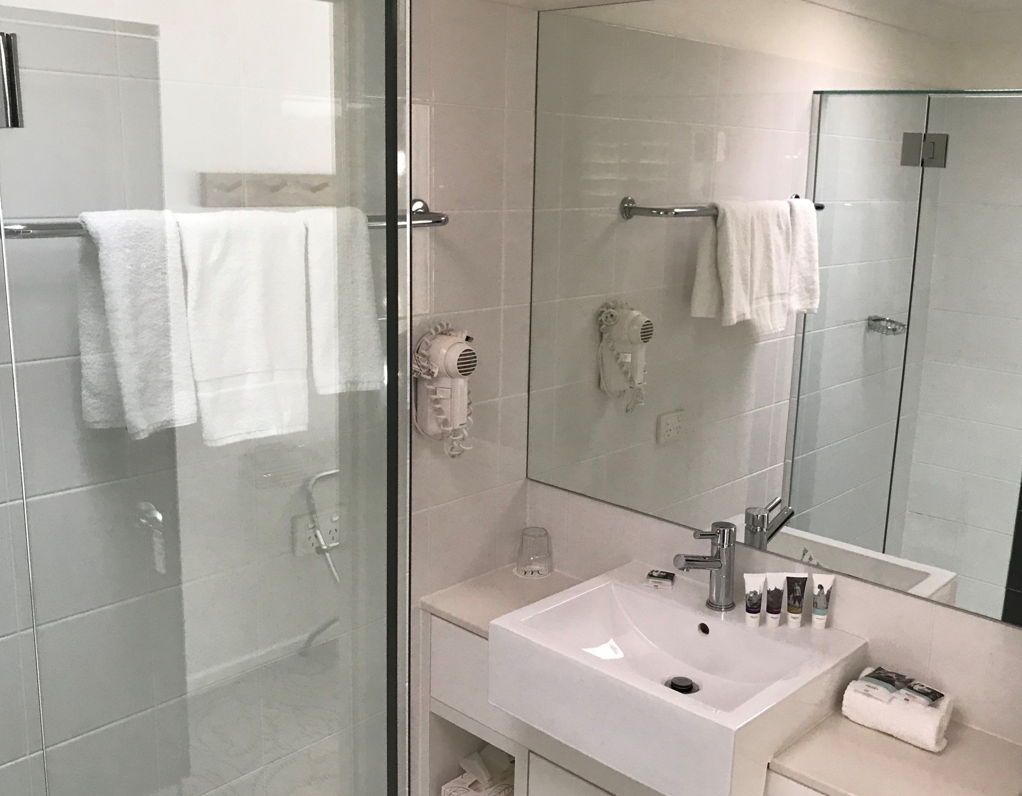 shower, eco-friendly toiletries, hair dryer, towels