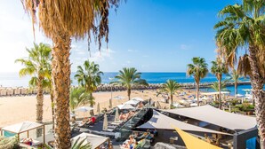 A resort with a pool area, lounge chairs, and a view of the beach and ocean. - Calheta Beach - All Inclusive (Calheta)