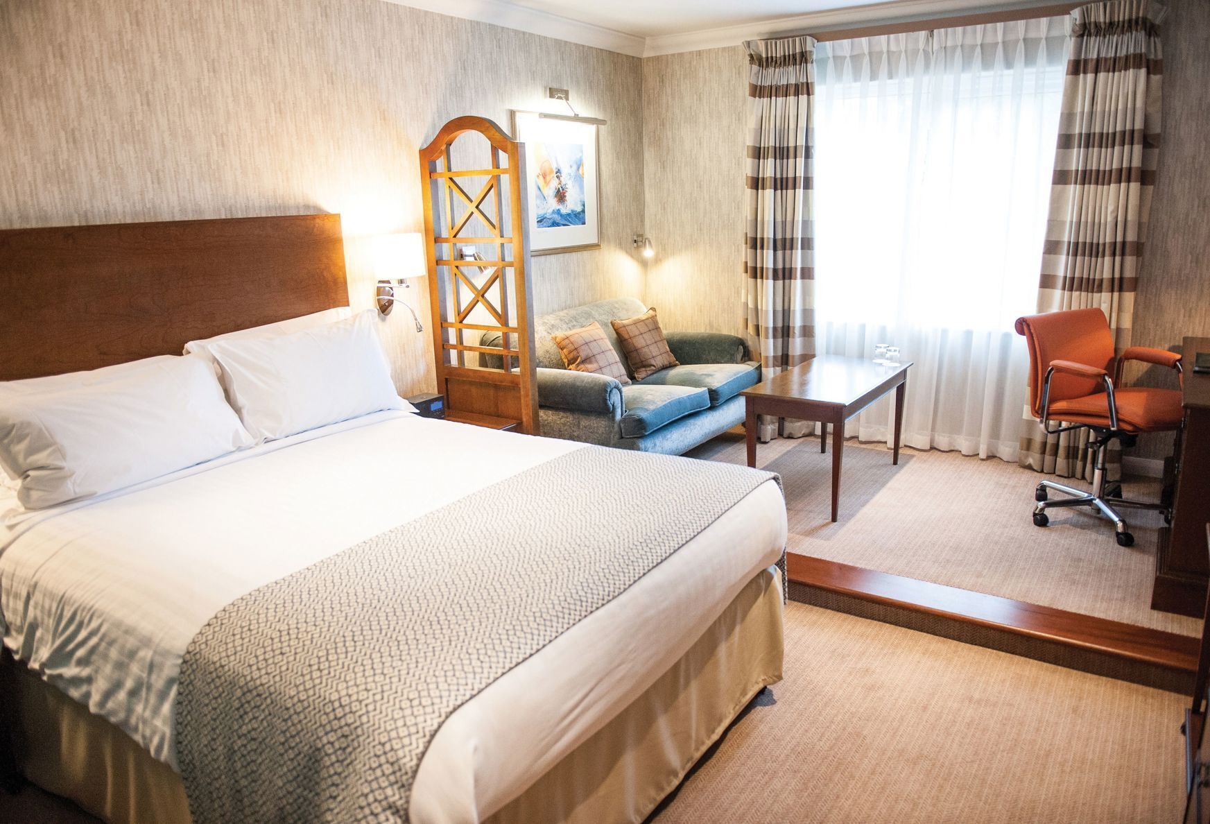 Premium bedding, desk, laptop workspace, blackout curtains