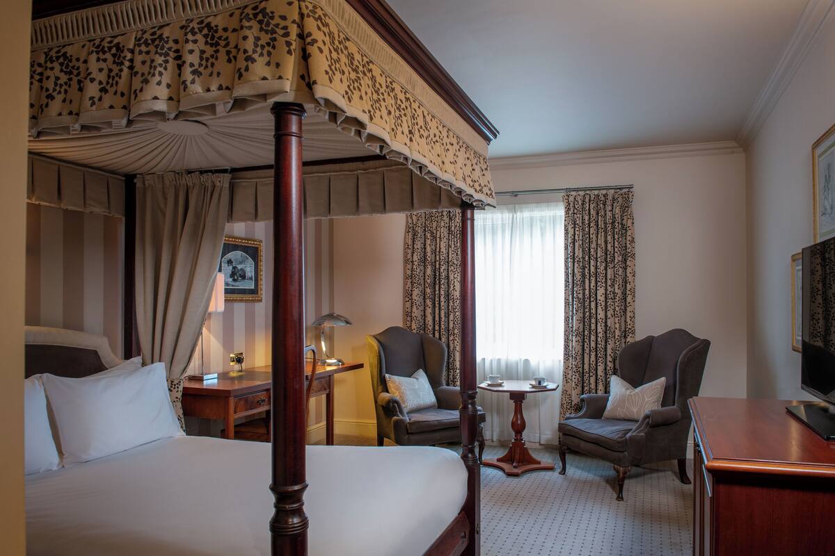 Standard Room (Four Poster Bed) | Premium bedding, desk, laptop workspace, blackout drapes