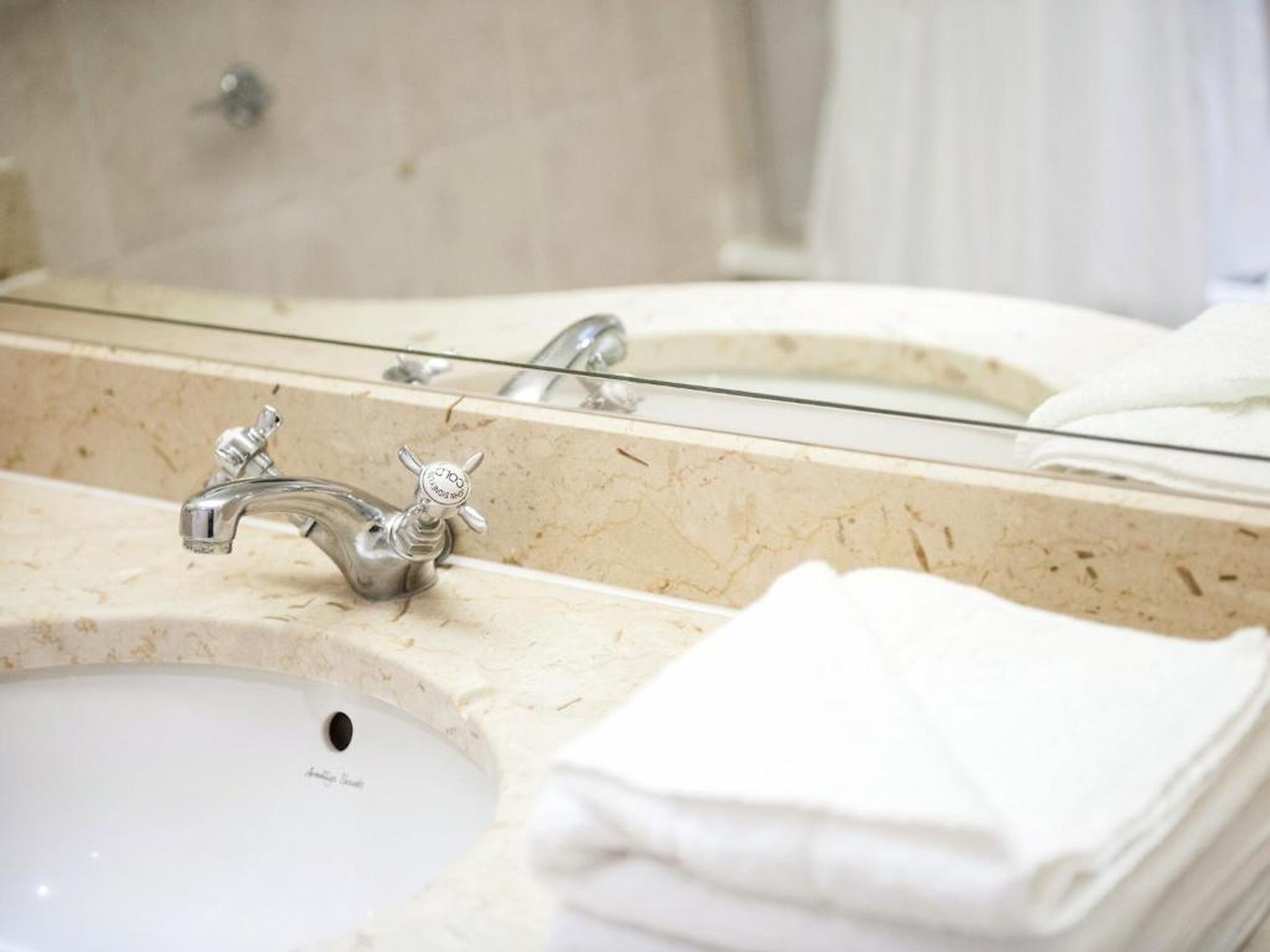 combined shower/bathtub, designer toiletries, hair dryer, bathrobes