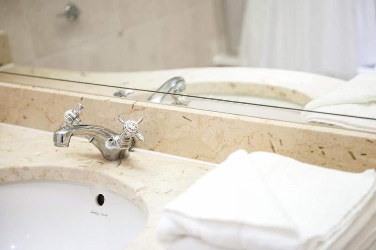 combined shower/bathtub, designer toiletries, hair dryer, bathrobes