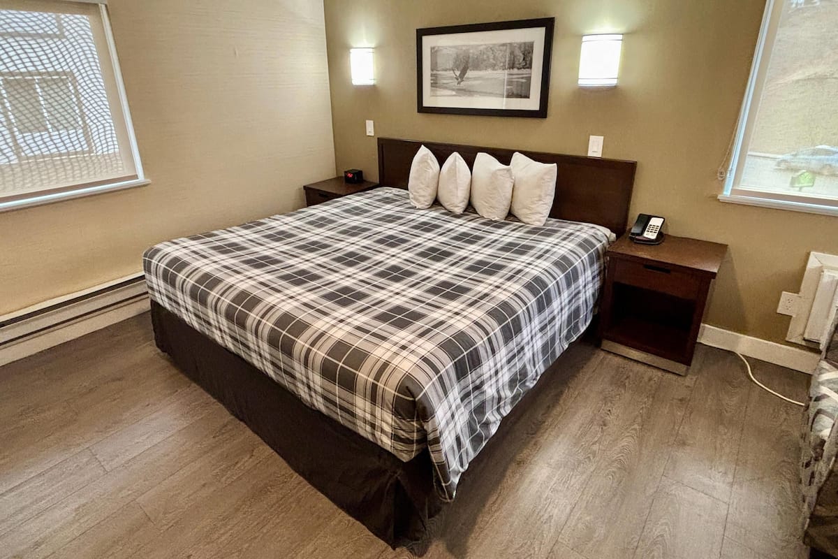 Premium bedding, desk, laptop workspace, blackout drapes