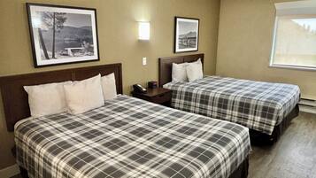 Premium bedding, desk, laptop workspace, blackout drapes