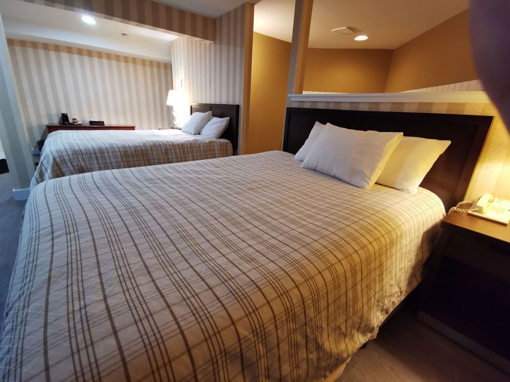 Premium bedding, desk, laptop workspace, blackout drapes