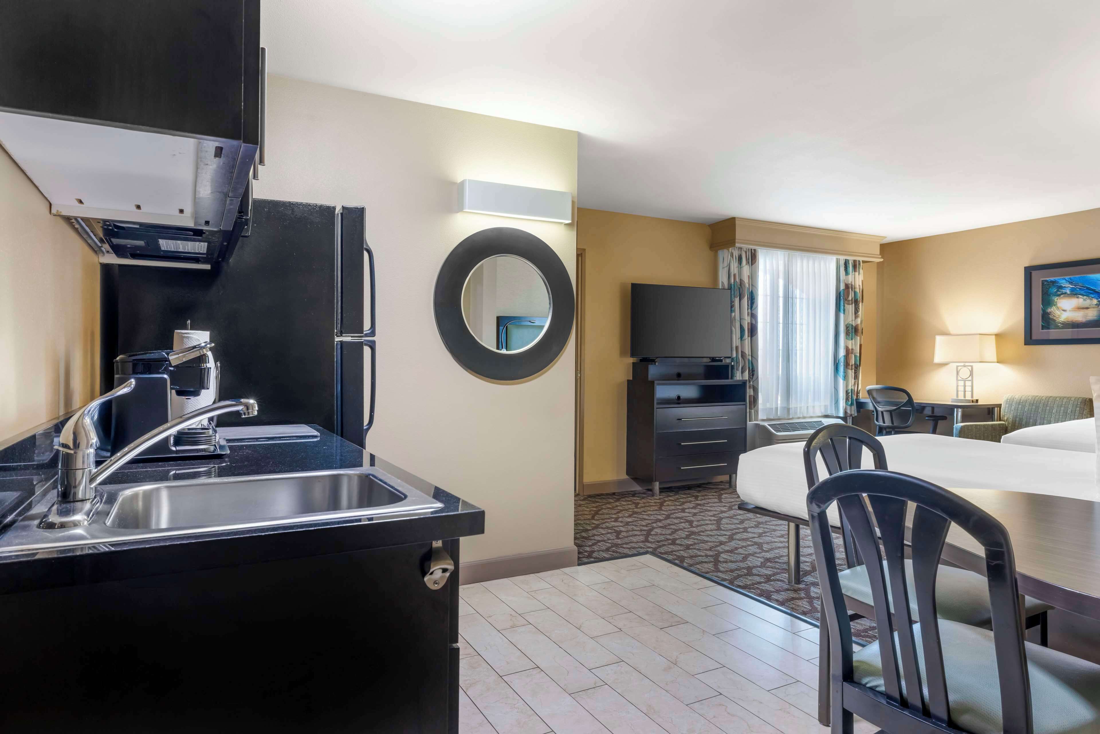 desk, laptop workspace, blackout curtains, iron/ironing board