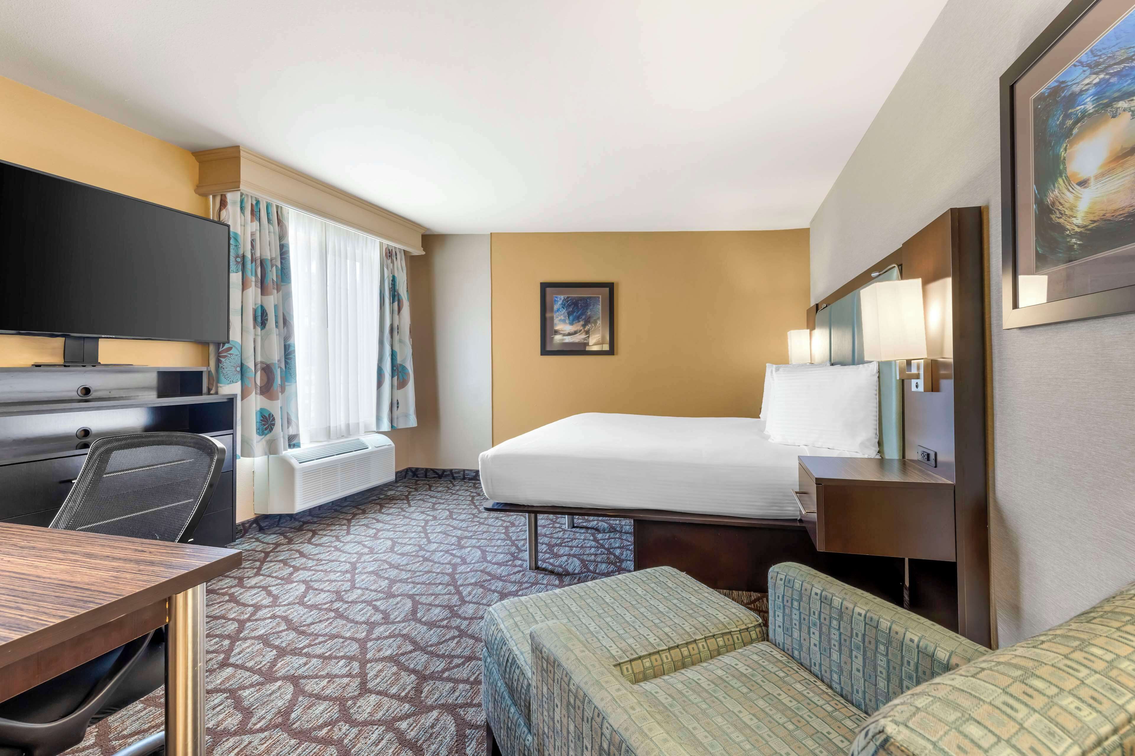 desk, laptop workspace, blackout curtains, iron/ironing board