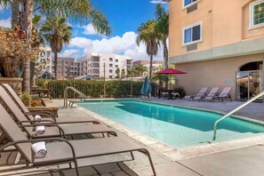 Outdoor pool, open 9:00 AM to 10:00 PM, pool umbrellas, pool loungers