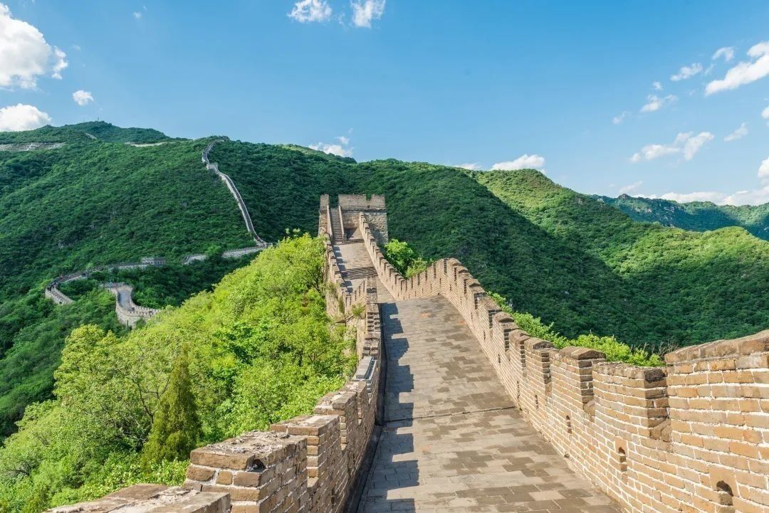 A section of the Great Wall of China with a clear path and steep, brick walls.