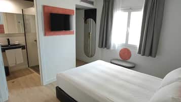 Habitación individual económica | Minibar, caja fuerte, escritorio y wifi gratis