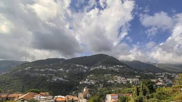 A mountainous landscape with a town nestled in the valley.