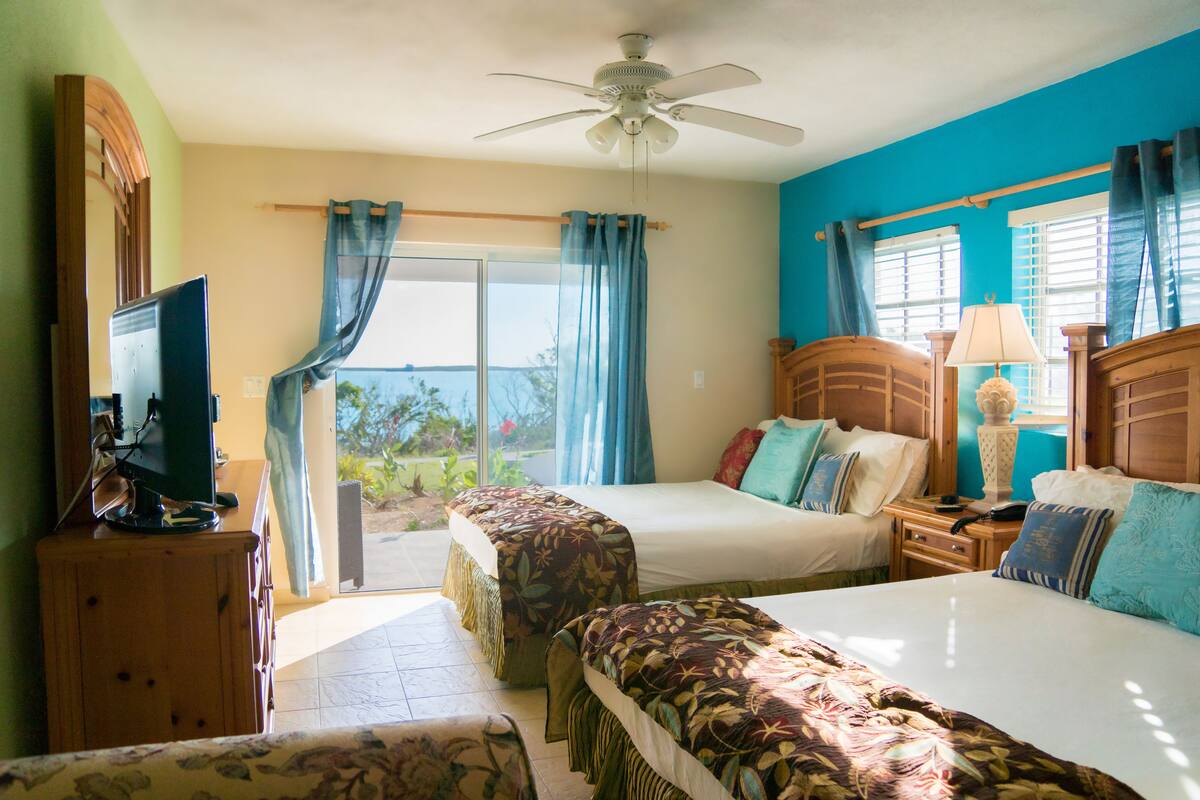 deluxe double room, 2 queen beds, beach view | 1 bedroom, egyptian cotton sheets, premium bedding